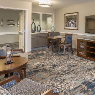 A cozy living room with modern decor and comfortable seating.