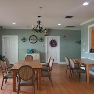 A cozy dining room with wooden furniture and elegant decor.