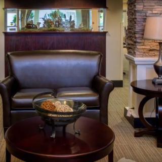 Cozy seating area with a leather sofa and a decorative table setup.