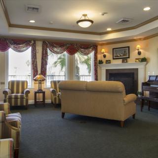 A cozy living room with elegant furniture and a fireplace.