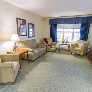 A cozy living room with comfortable seating and natural light.