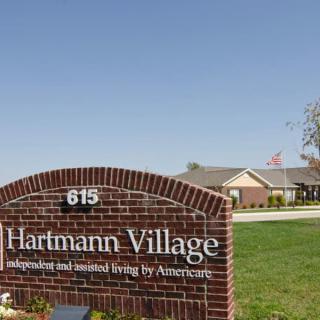Entrance sign to Hartmann Village, an assisted living facility.