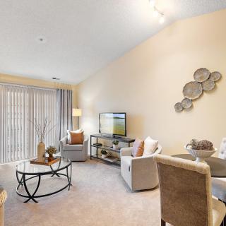 A cozy and modern living room with comfortable seating and stylish decor.