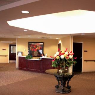 A welcoming reception area with stylish furniture and floral arrangements.