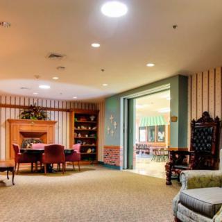 A cozy living room with a fireplace and comfortable seating.