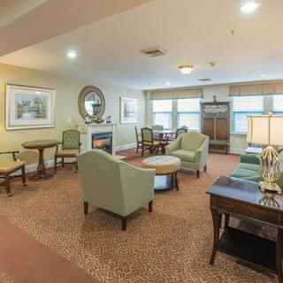 A cozy living room with comfortable seating and elegant decor.