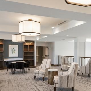A modern lobby with comfortable seating and stylish lighting fixtures.
