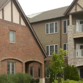 A residential building with a combination of brick and stone facade.