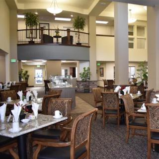 A spacious dining area with neatly arranged tables and chairs ready for guests.