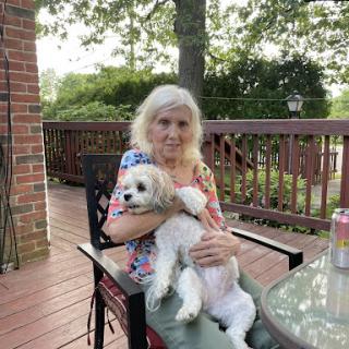 A serene moment on the deck with a loving pet.