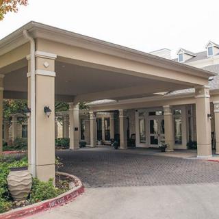 An exterior entrance with a covered canopy at a building.