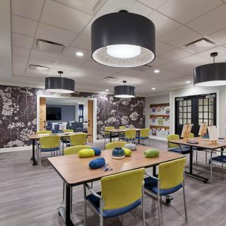 A modern conference room with stylish furniture and lighting.