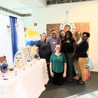 A joyful gathering celebrating a special occasion with friends and decorations.