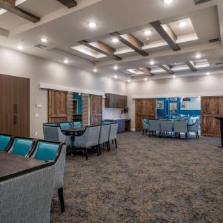 A modern conference room featuring stylish furniture and bright ceiling lights.