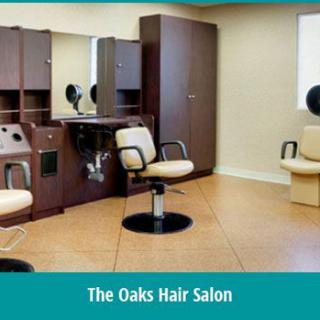 Interior of The Oaks Hair Salon featuring styling chairs and stations.