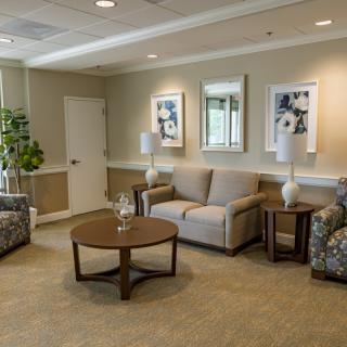A cozy waiting room with comfortable seating and elegant decor.