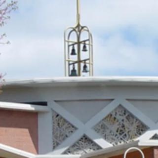 A church bell tower with decorative architectural elements.