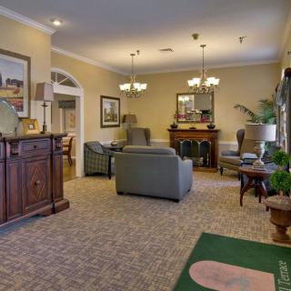 A cozy living room with elegant furniture and a warm fireplace.