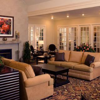 A cozy living room with comfortable seating and elegant decor.