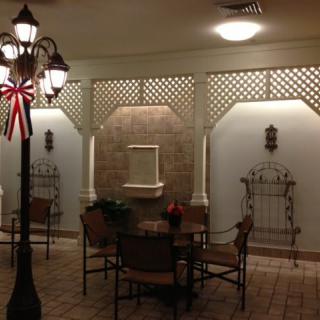 Cozy indoor patio area with seating and decorative elements.
