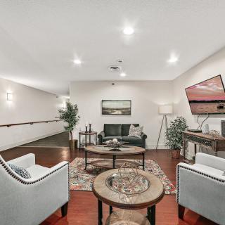 A modern living room with comfortable seating and stylish decor.