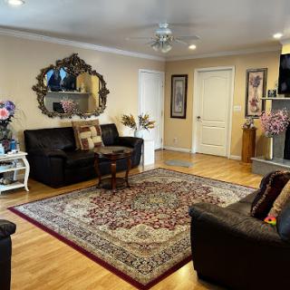 A cozy and inviting living room featuring elegant furniture and decorative elements.