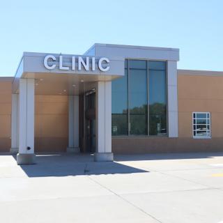 A modern clinic building with clear signage.