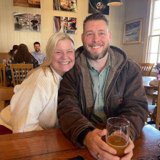 A joyful moment shared between friends at a cozy restaurant.