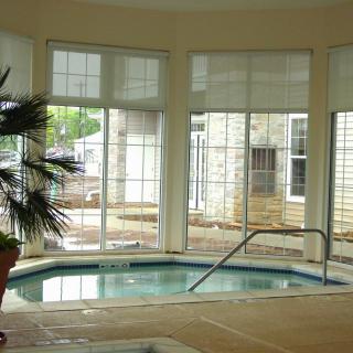 A cozy indoor spa with large windows and natural light.