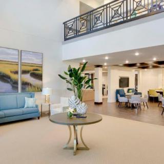 A beautifully designed modern living area featuring comfortable seating and stylish decor.