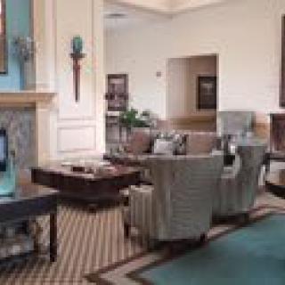 A spacious hotel lobby with elegant seating and a cozy atmosphere.