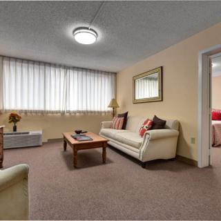 A cozy living room with comfortable seating and warm lighting.