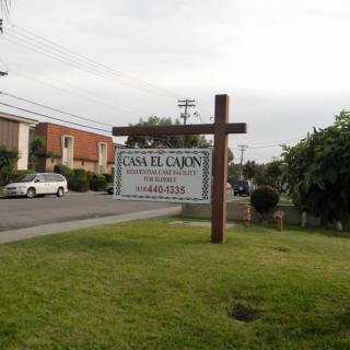 A street view featuring a sign for Casa El Cajon restaurant.