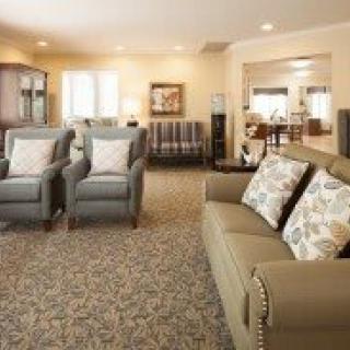 A cozy living room with comfortable seating and warm lighting.