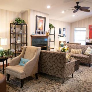 Cozy living room with elegant furniture and warm decor.