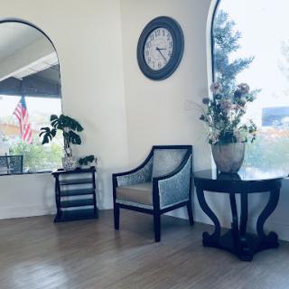 A cozy living space featuring elegant furniture and decorative elements.