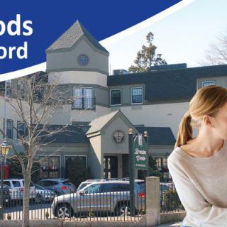 A composite image showing a building with cars parked in front and a person looking at a laptop, under the text 'Woods Rd'.