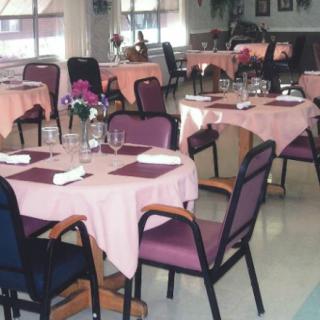 A cozy restaurant dining area with neatly arranged tables and chairs.