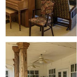 A cozy living space featuring a piano and chairs, complemented by rustic wooden columns and a ceiling fan.