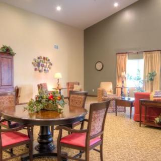 A cozy living room interior with elegant seating and decor.