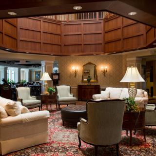 A cozy lobby area with comfortable seating and warm lighting.