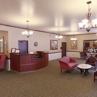 A well-designed reception area featuring comfortable seating and elegant lighting.