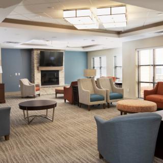 A modern and cozy living room featuring comfortable seating and contemporary design elements.
