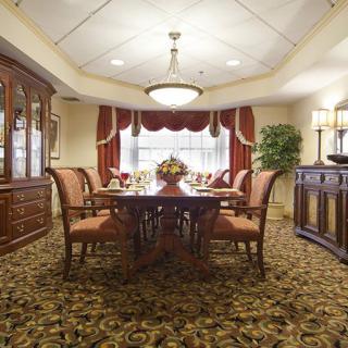 A luxurious dining room with classic furniture and elegant decor.