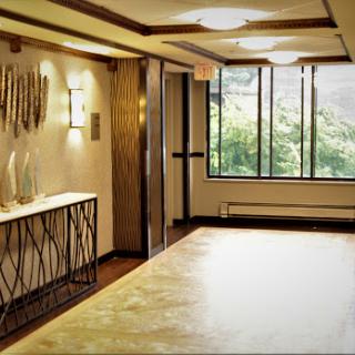 A stylish and modern interior space featuring elegant lighting and natural elements.