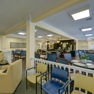 A cozy cafe interior with various seating options and ambient lighting.