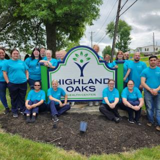 A vibrant team from Highland Oaks gathered for a group photo, showcasing their enthusiasm and community spirit.