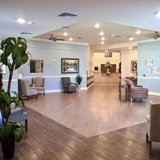 A spacious and modern lobby designed for comfort with stylish furniture and greenery.
