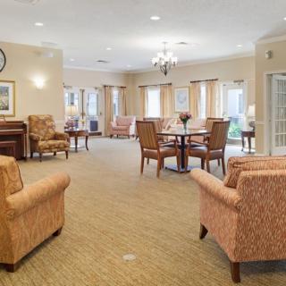 A cozy living room with comfortable seating and elegant decor.