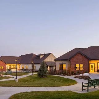A peaceful residential area with several houses at sunset.